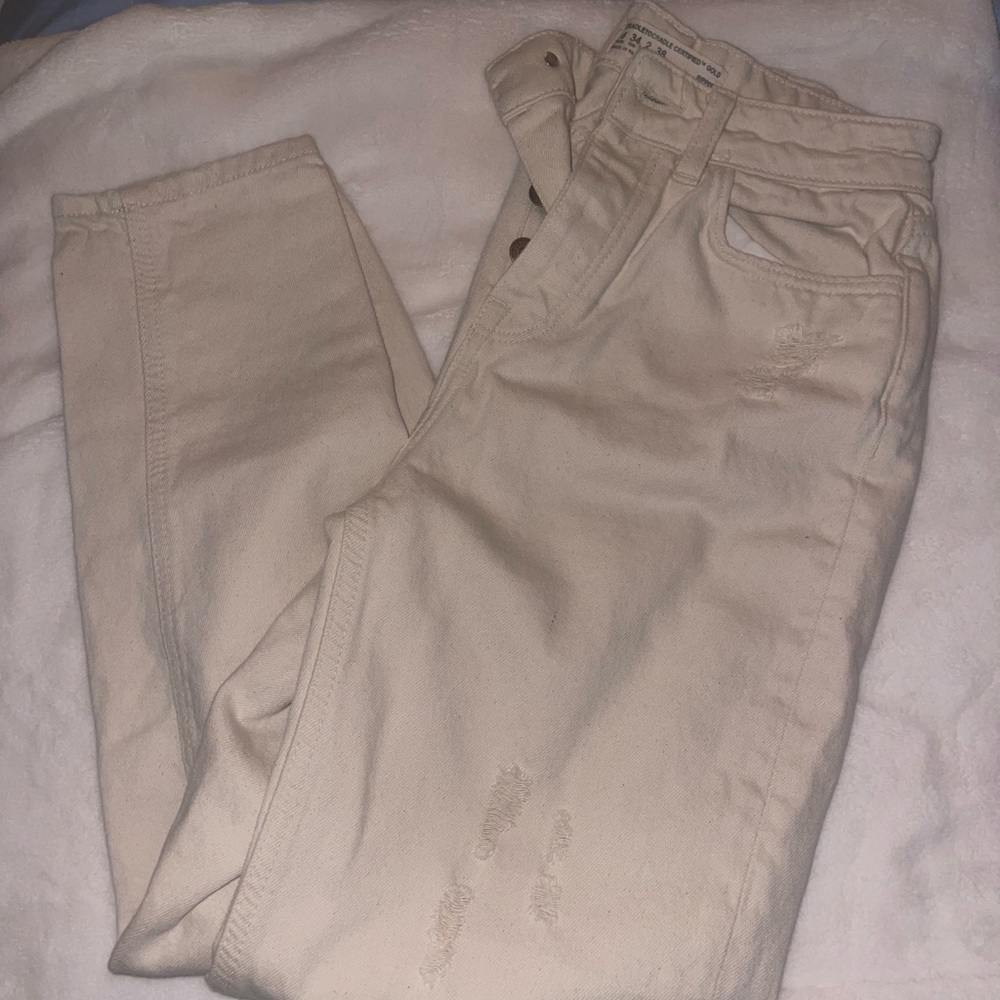 cream ripped jeans